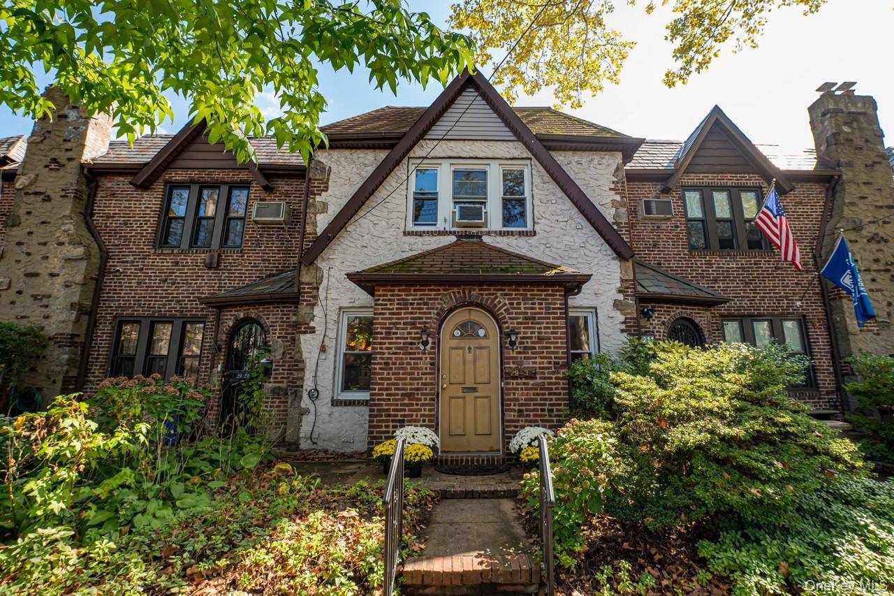Nestled on a tree lined street in a welcoming neighborhood, discover the timeless character of this classic brick Tudor perfectly situated in the desirable neighborhood of North Flushing.