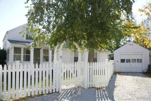 Cloud 9 is a sweet pink cottage by the shore reminiscent of childhood days at the beach.
