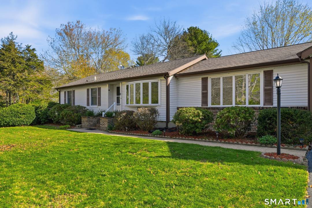 Set on a quiet corner lot in a desirable Old Lyme neighborhood, 5 Sunset Drive offers a warm and inviting setting with excellent natural light and a sunny, usable yard.