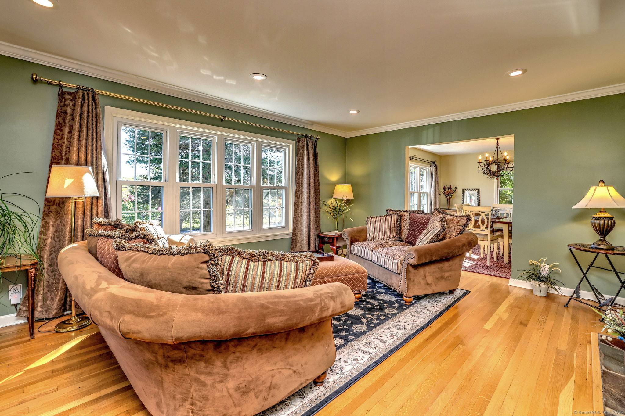 A pristine expanded cape overlooking open space is the setting for this lovingly cared for home.