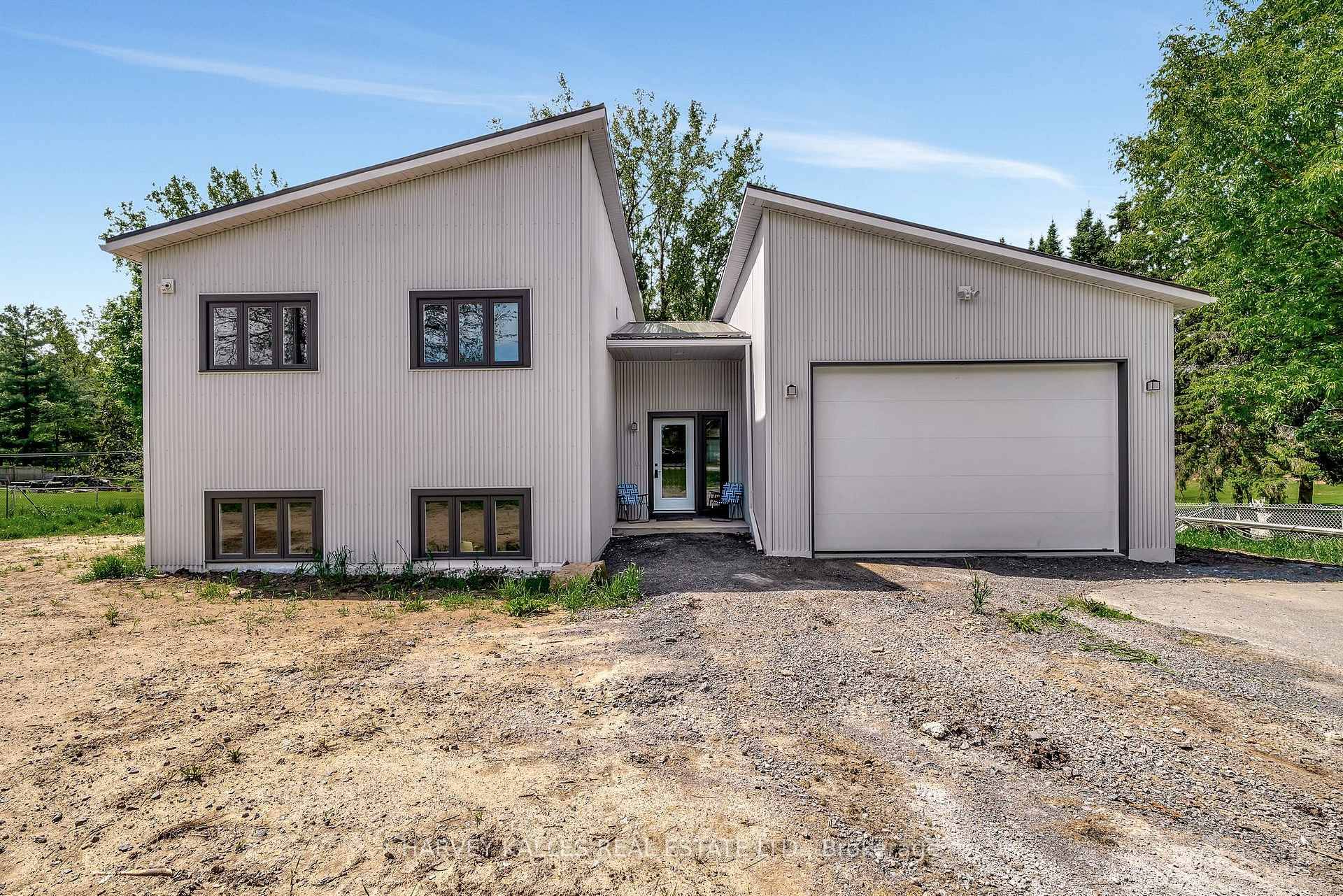 Discover modern County living in this beautifully built side split home on a large lot in Picton.