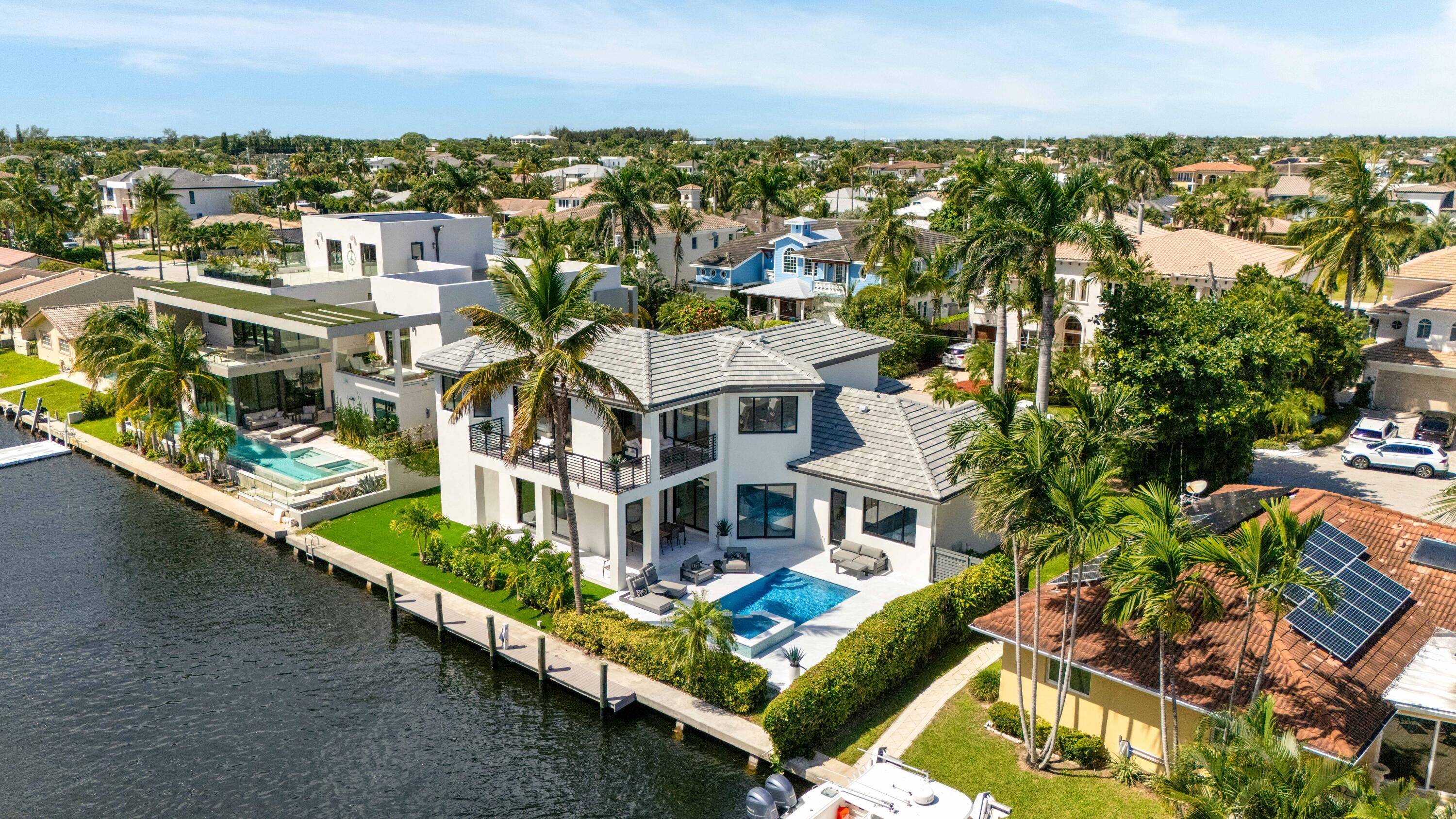Welcome to this fully renovated waterfront home in East Boca Raton's highly sought after Boca Keys community.