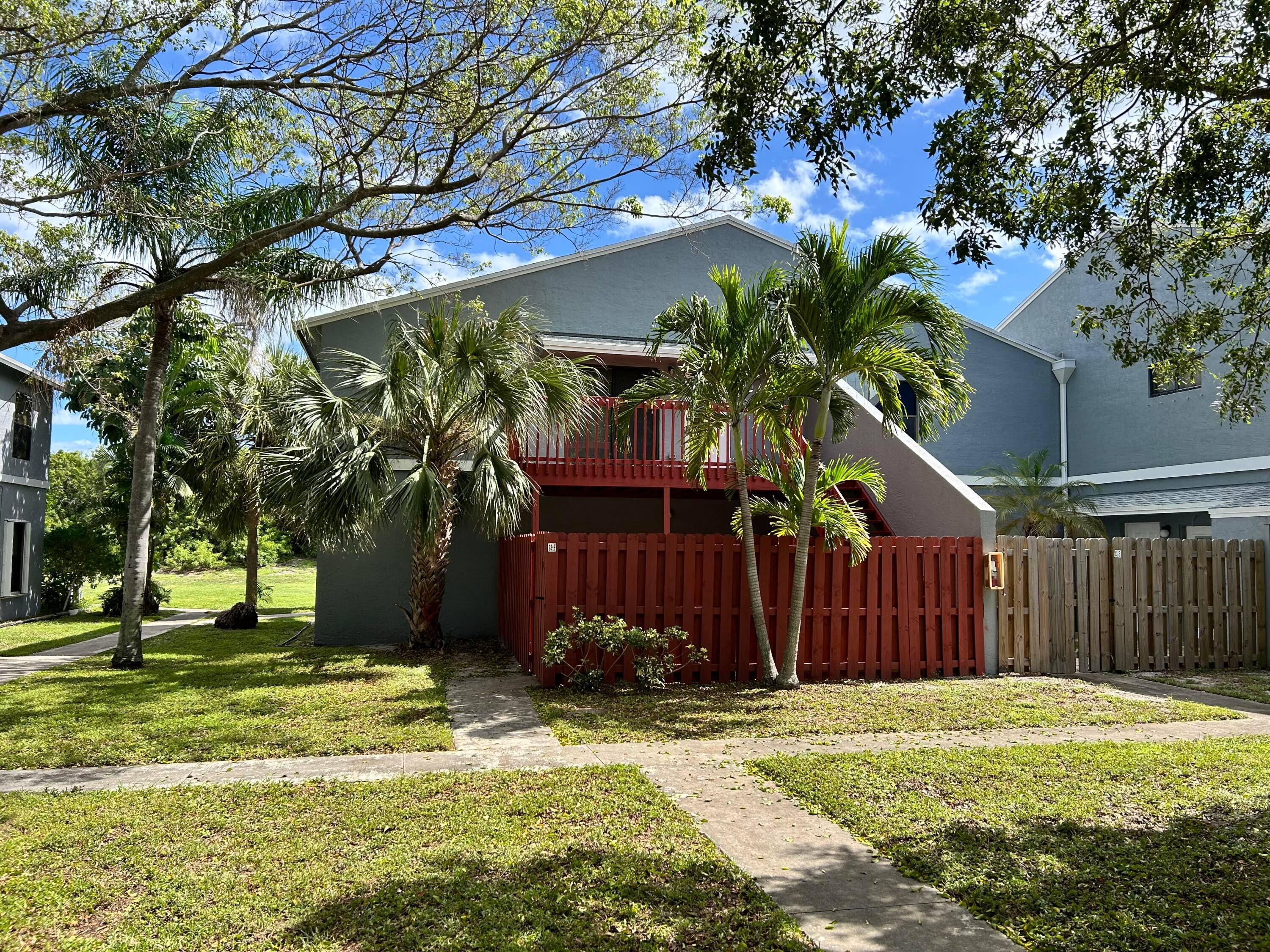2 Bed, 2 full bath condo on second floor with large deck and a fenced courtyard area.