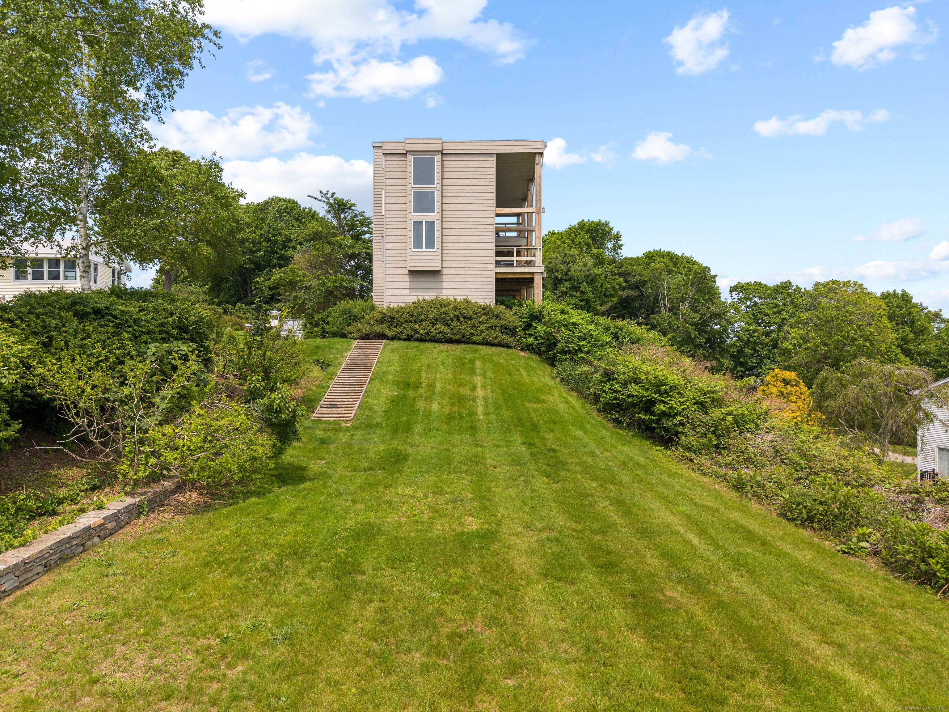 Perched above it all, enjoy treetop views of the Long Island Sound and Spicer's Marina.