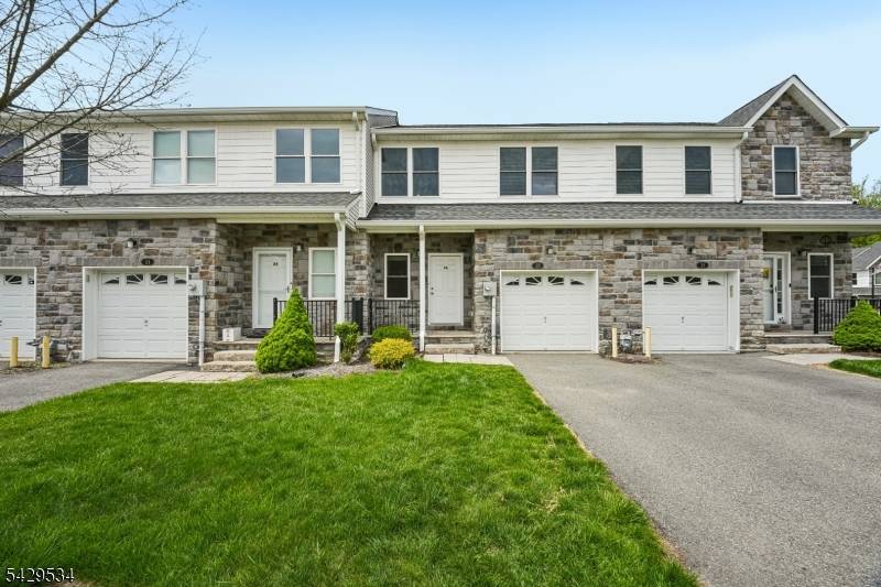 Tucked into a lush, intimate community, this elegant townhome pairs timeless elegance with everyday ease.