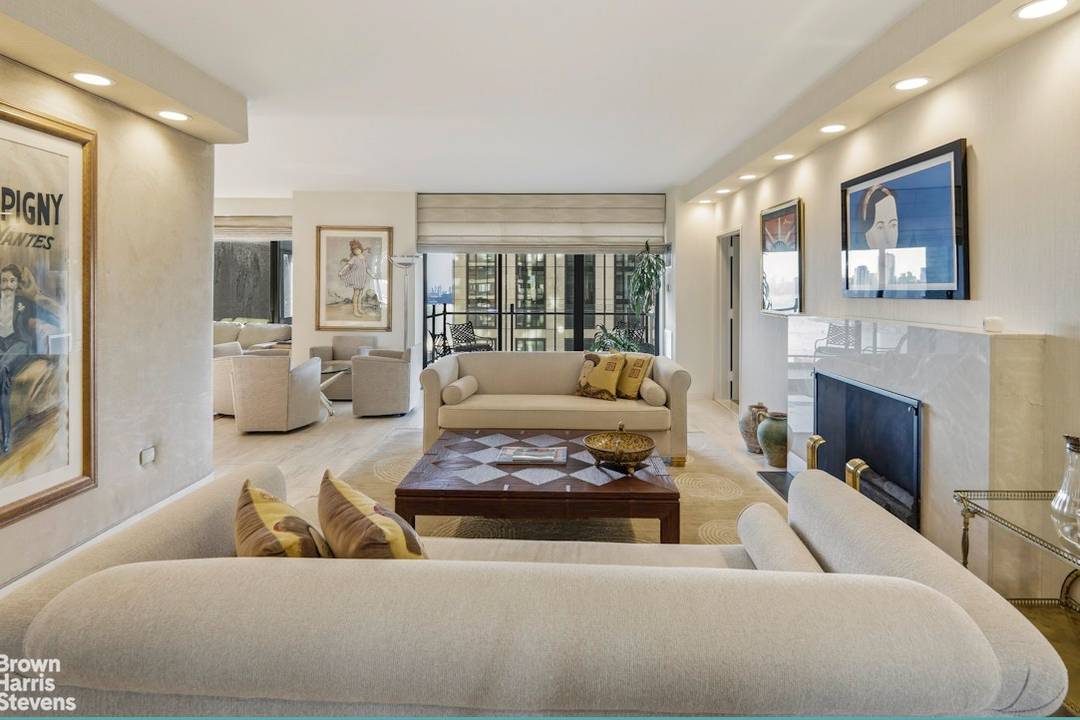 Enter from a semi private landing to a gracious foyer which opens to a 65 ft.