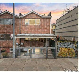 Investor Opportunity ! Solid brick semi detached two family property featuring two spacious 3 bedroom, 2 bathroom apartments and a finished walk out basement.