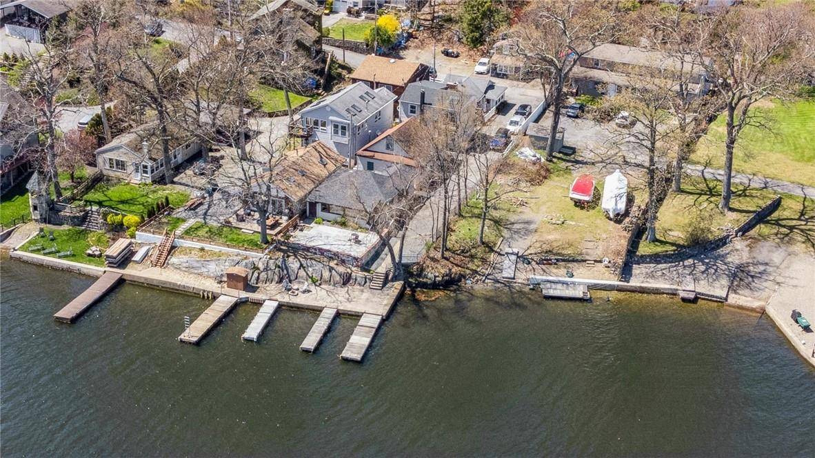 This beautifully appointed, two story lake house is move in ready and packed with features, including a deeded boat slip and private beach just steps away from the home !
