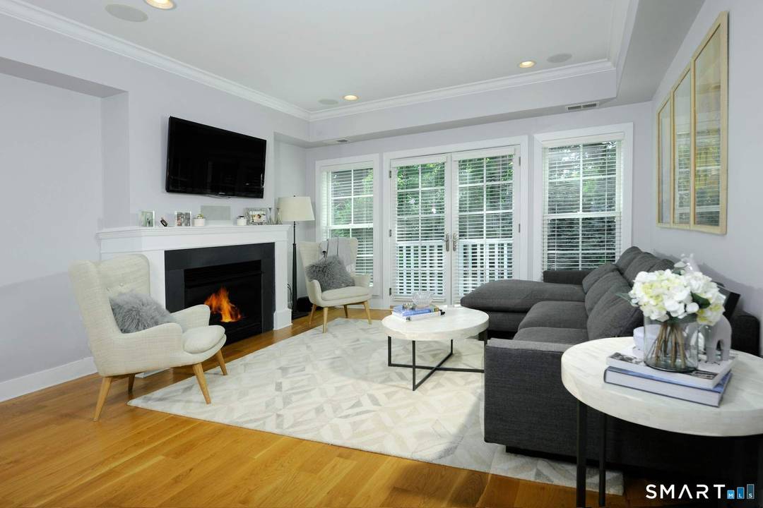 LOCATION ! This pristine and sun filled townhouse is in the gated Palmer Hill Association located on the Old Greenwich Stamford townline.