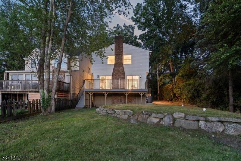 Welcome to this stunning custom lakefront home offering serene water views and a peaceful natural setting.