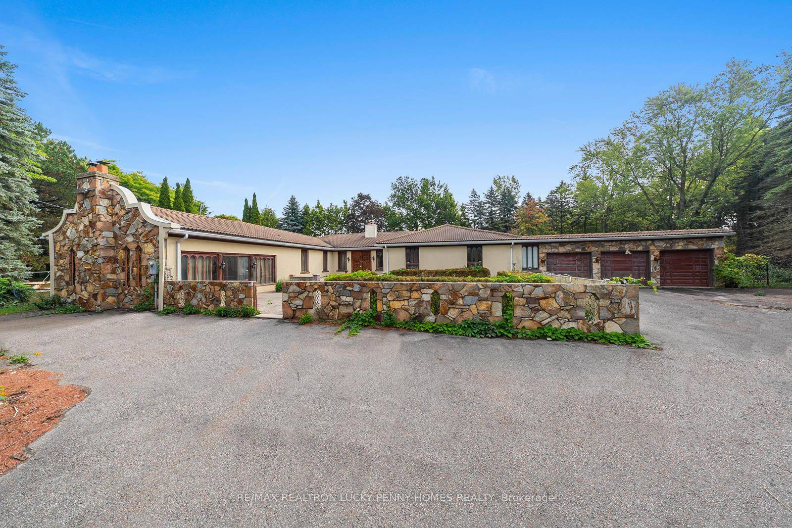 This spacious 4 bedroom bungalow sits on a beautiful tree lined lot of approximately 1.