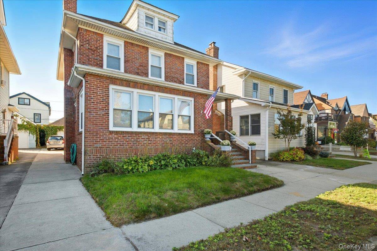 Long Beach Westholme Area Colonial featuring 5brs, 2 f bths, Livingroom w Fireplace, Formal Dining Room, enclosed porch, full basement, yard, garage.