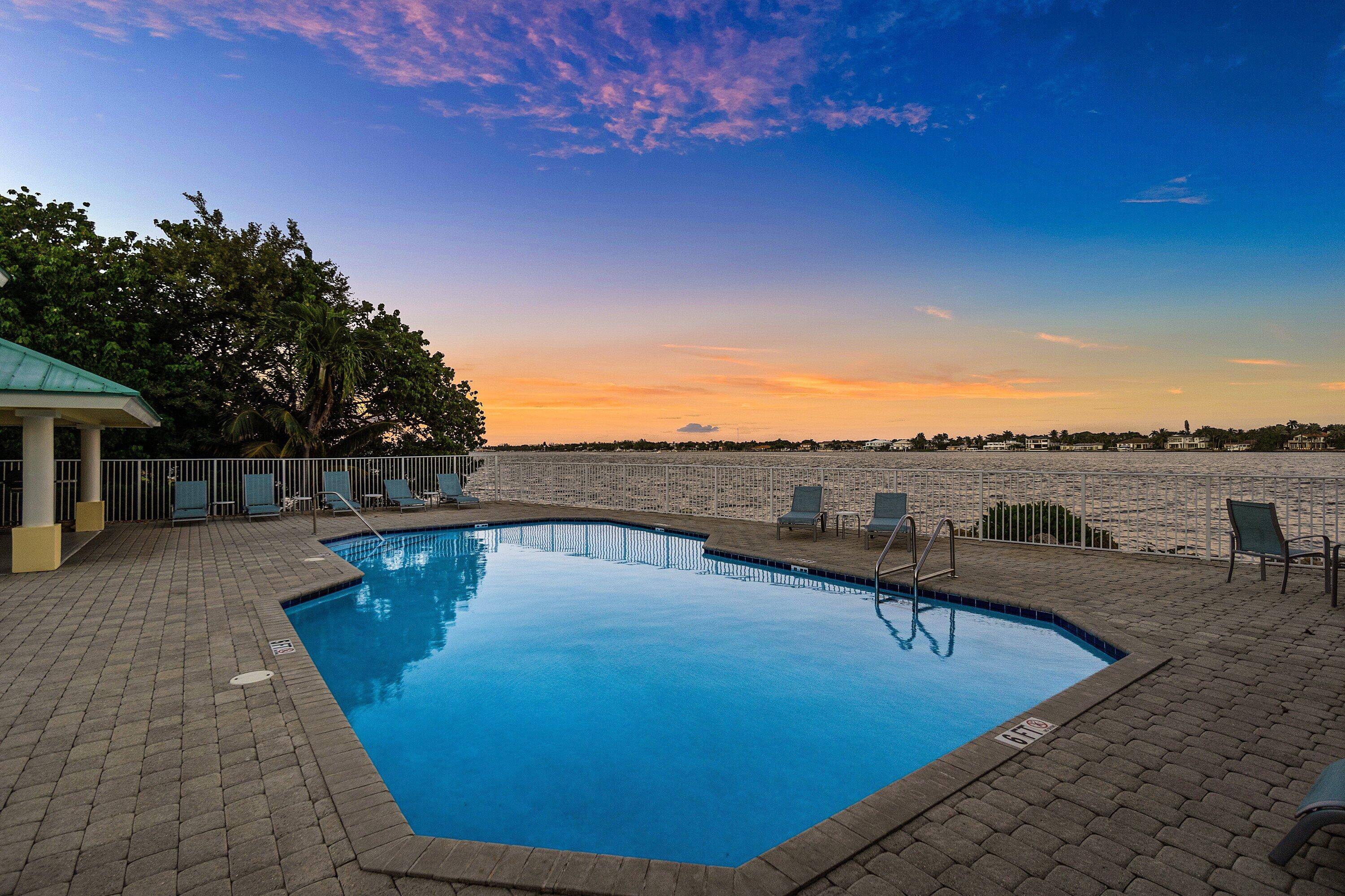 COASTAL LIVING Beautifully landscaped Key West style luxury townhome in gated Barefoot Cove, steps from the Intracoastal and only 2 miles from the beach.