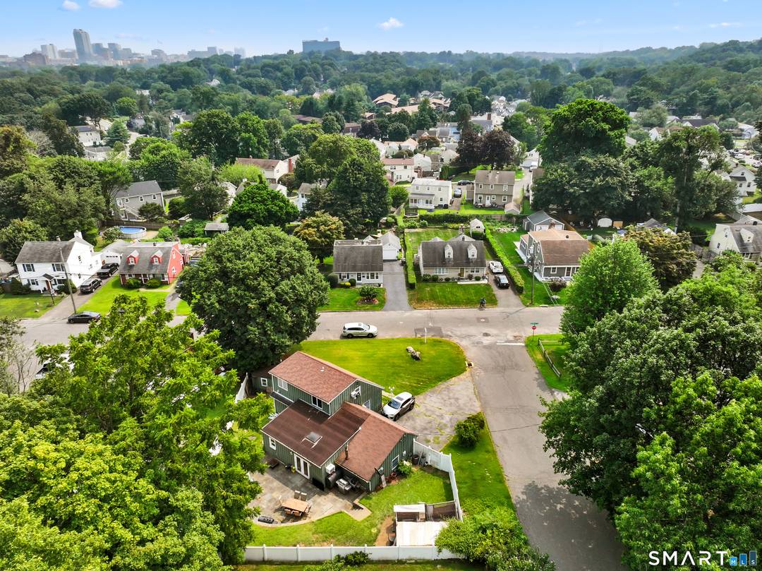 Welcome home to this warm and inviting 3 bedroom, 3 bath residence in Stamford's desirable Ridgeway neighborhood.