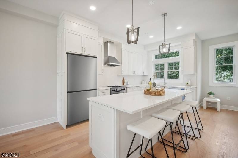 NEW CONSTRUCTION ! Superbly designed CUSTOM townhouse with fabulous open floor plan boasting high ceilings, modern bathrooms and oak hardwood floors throughout.