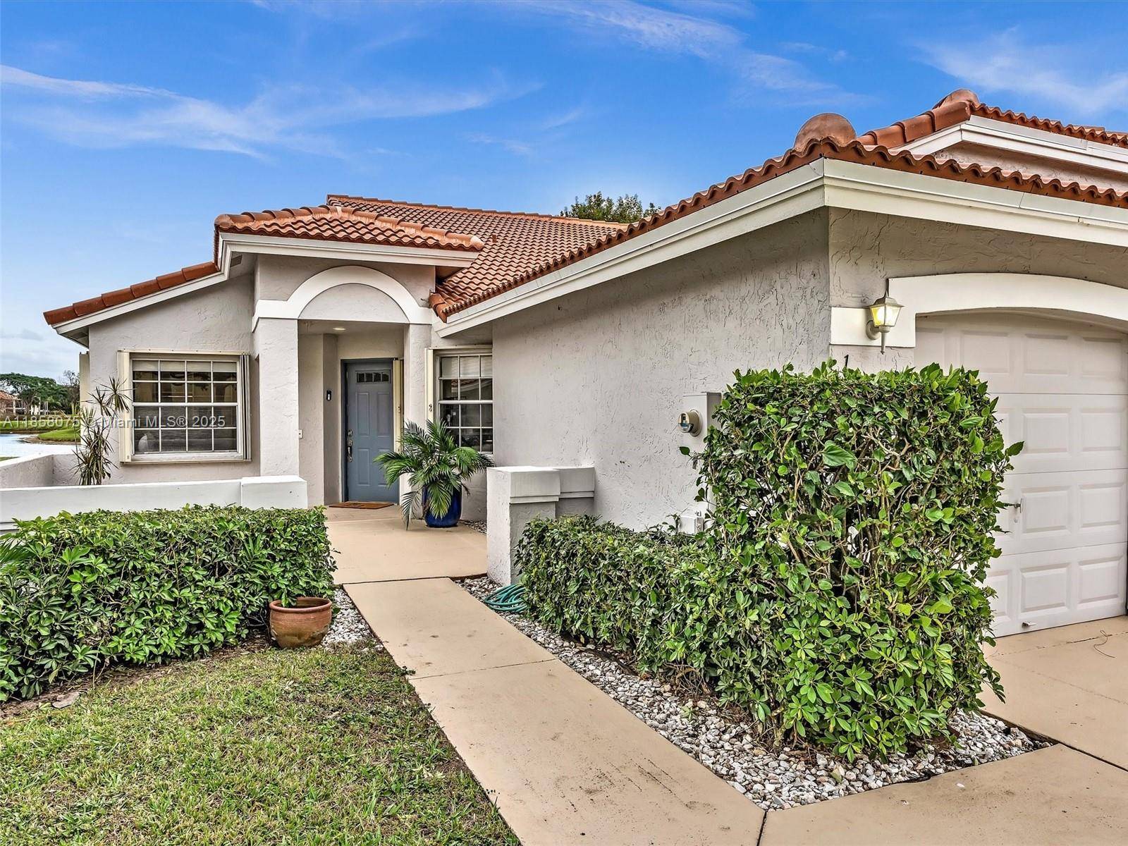 Charming 2 bed 2 bath corner villa w 1car garage is set on a picturesque lake, nestled in conveniently located gated community.