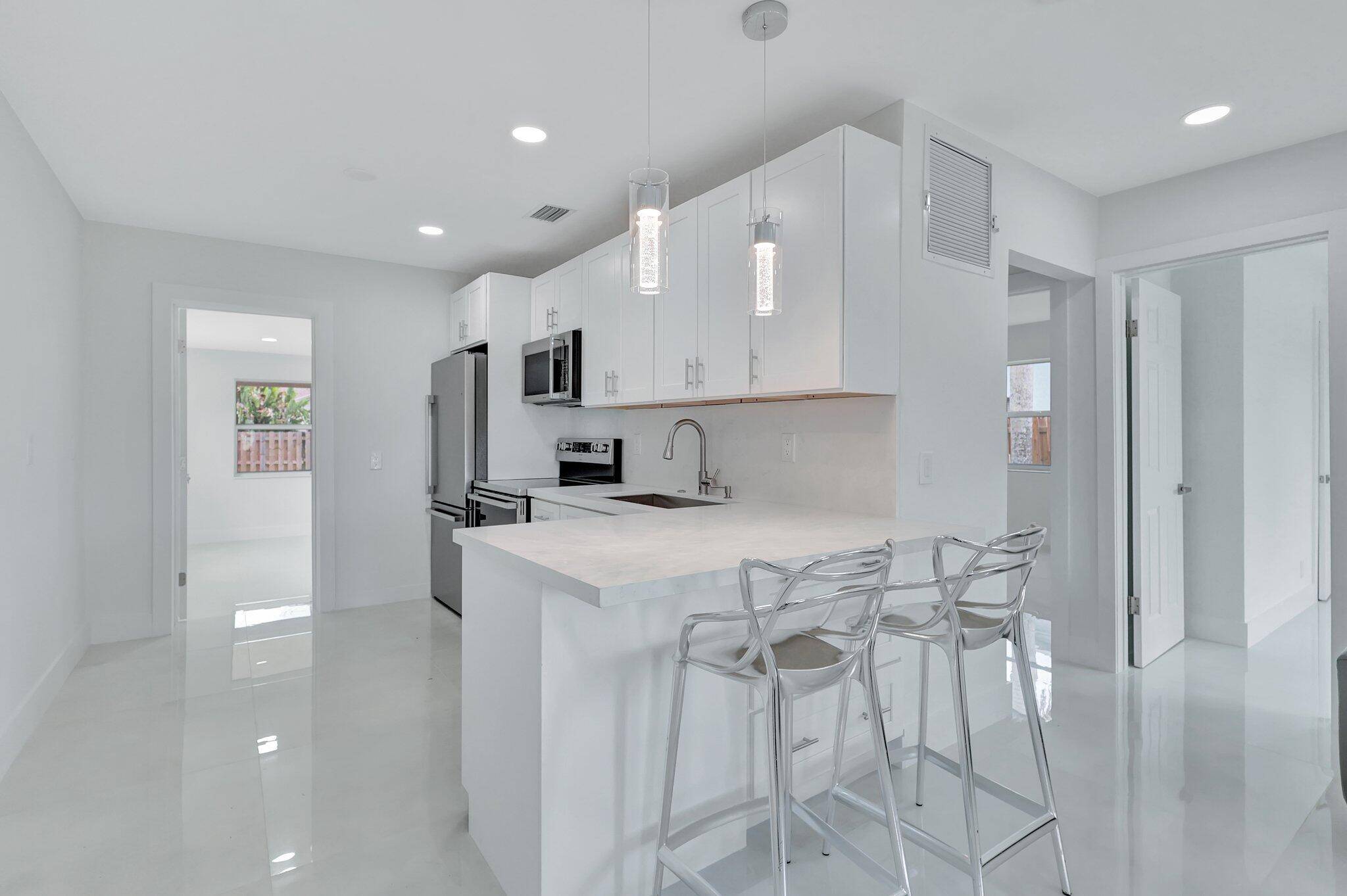 Fully renovated modern home nestled on fully fenced in private lot.