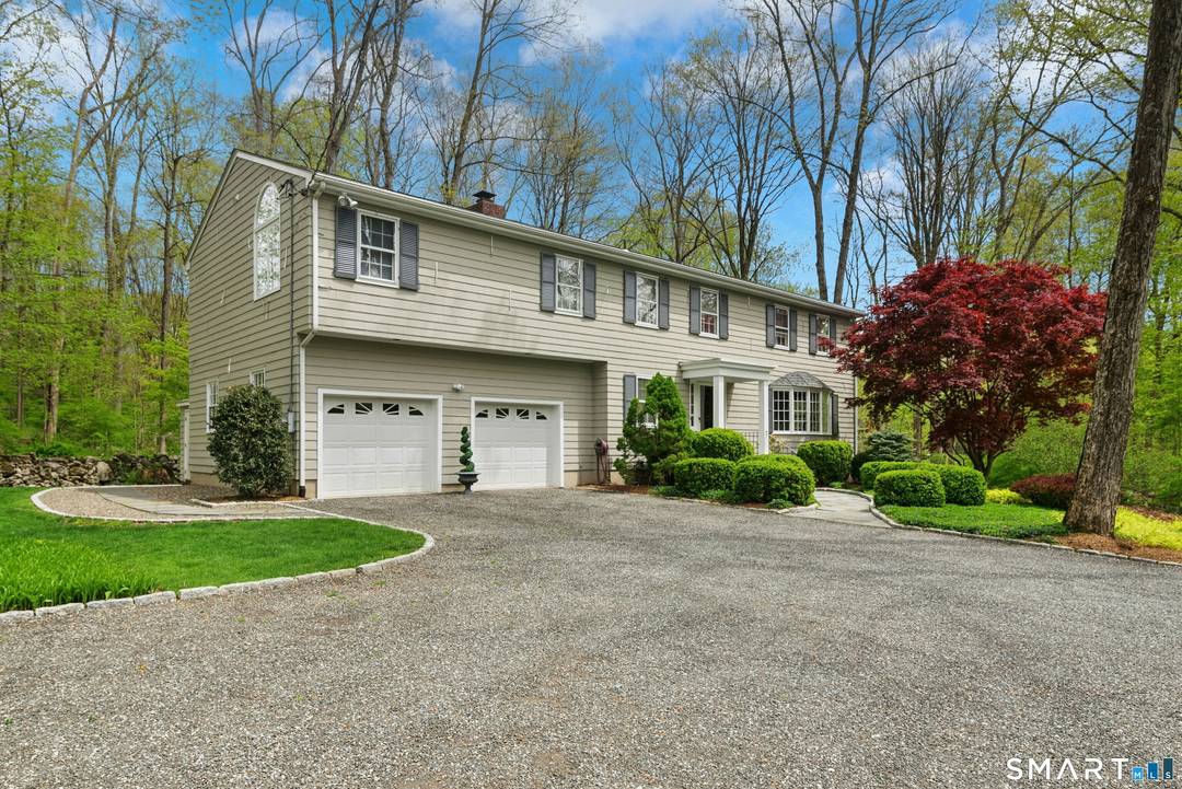 Your first impression ! A long dramatic driveway welcomes you to an entrance framed by professionally designed landscaping.