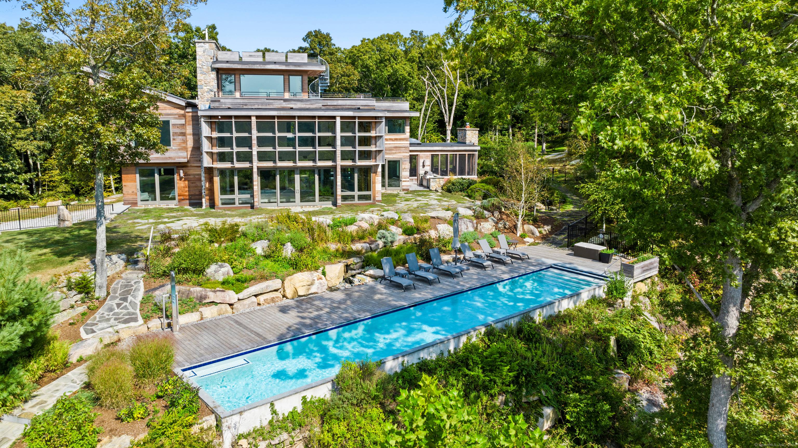 Nestled on 18 scenic acres in Lyme, Connecticut, this stunning 5, 800 square foot home is a showcase of contemporary design and sustainable living.