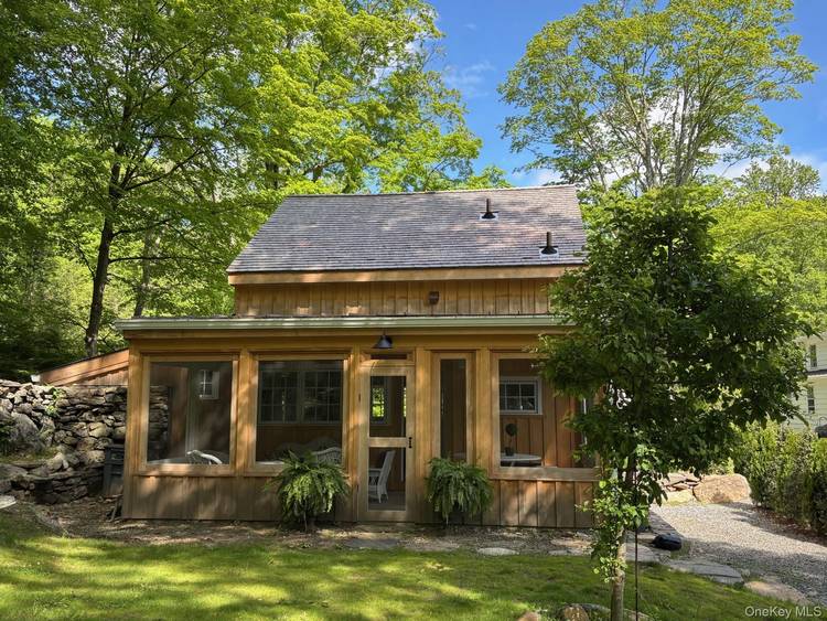 Located on two picturesque acres in the coveted Yale Farms Estates neighborhood of Armonk, this beautifully rebuilt cottage blends timeless charm with modern luxury.