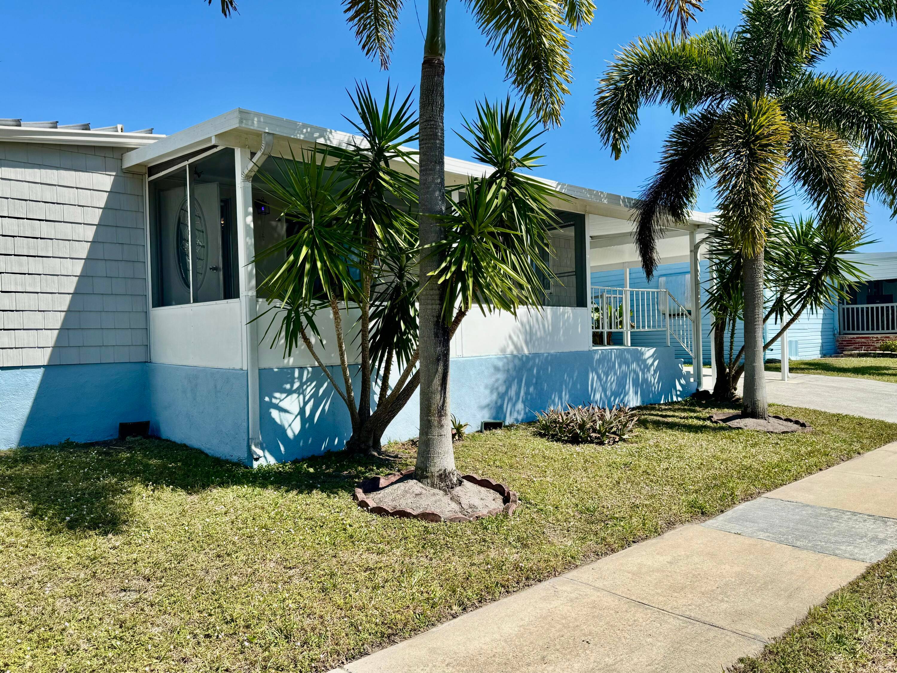 This charming 2 bedroom, 2 bathroom mobile home is located in the highly desirable 55 community of Tropical Breeze Estates in Boynton Beach, Florida.