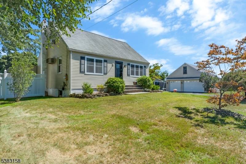 Welcome to this beautiful 3 bedroom Cape Cod situated on an oversized lot, offering both charm and functionality.