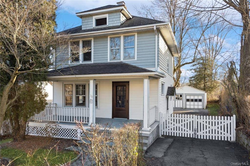 An inviting front porch welcomes you to this village colonial.
