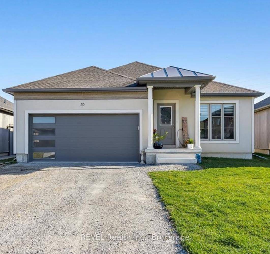 This charming lower level apartment combines coziness with modern amenities, making it an ideal living space.
