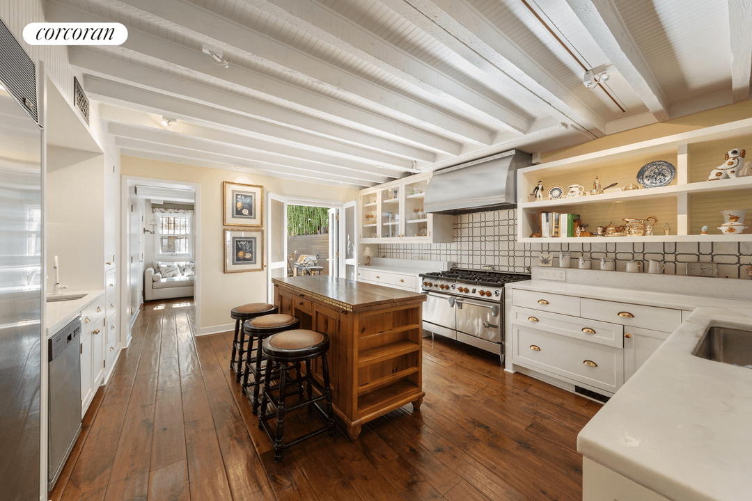 Situated mid block on this distinctive Upper West Side brownstone street, this elegant and sun flooded 18.