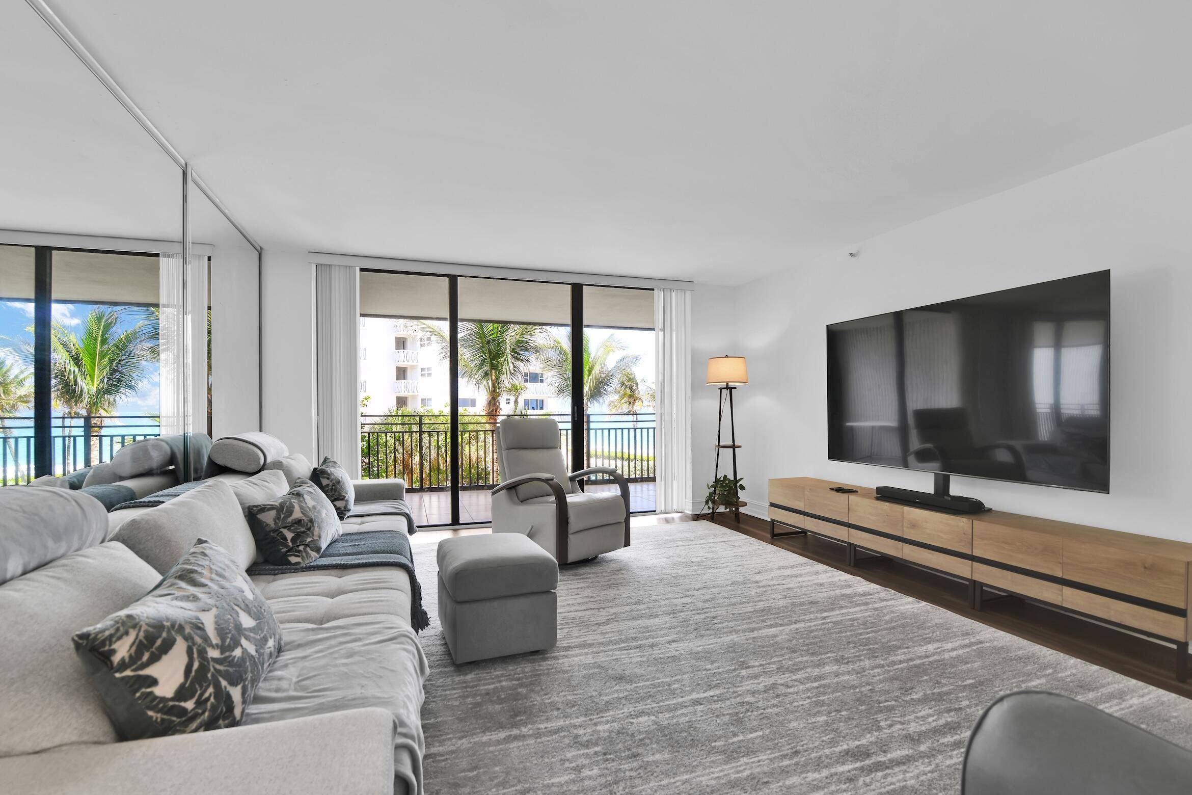 Experience beachfront living at its finest in this beautifully updated 2BR 2.