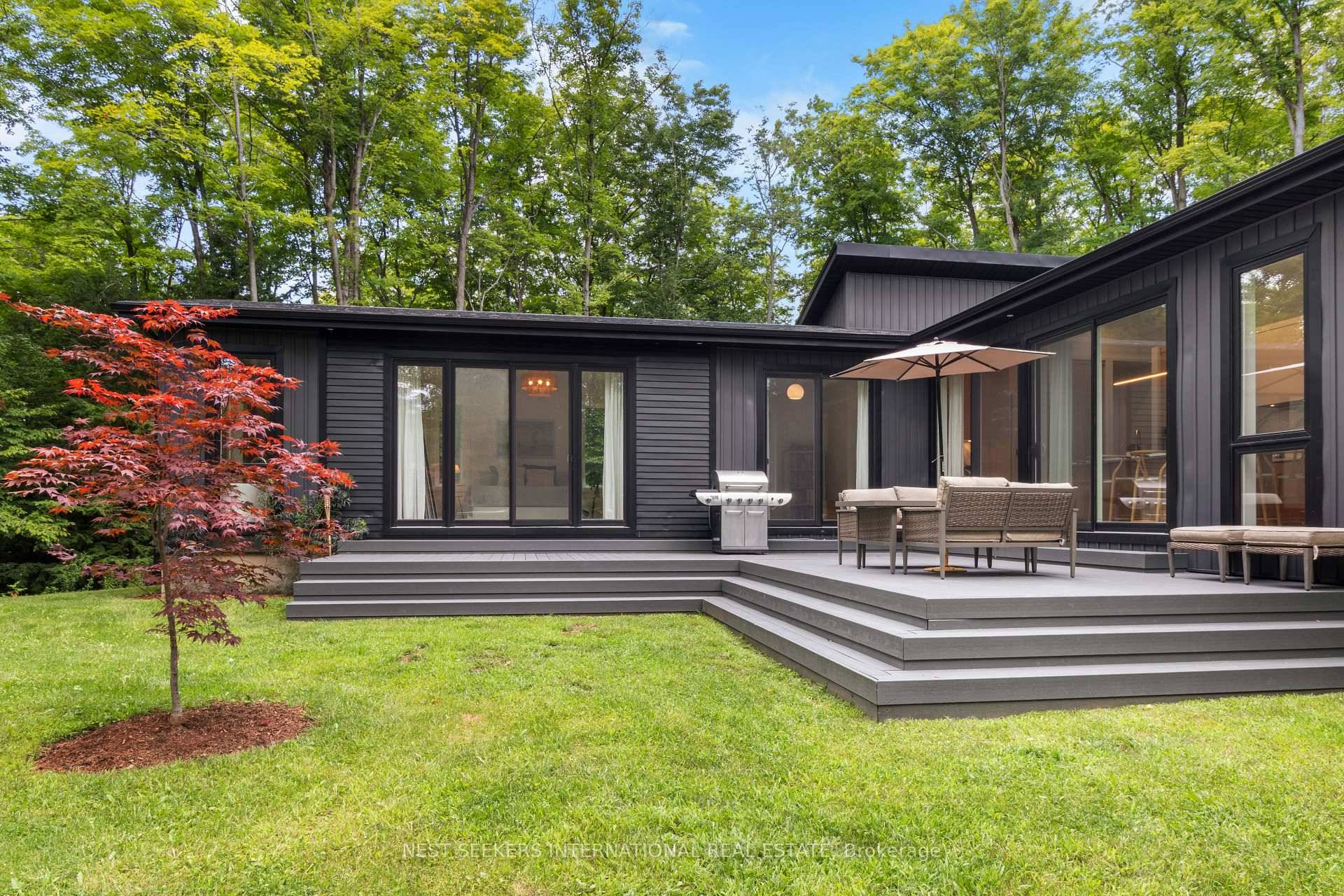 A private laneway leads to 45 acres and a custom built 4 bedroom, 4 bathroom bungalow, with nearly 3, 000 sq.