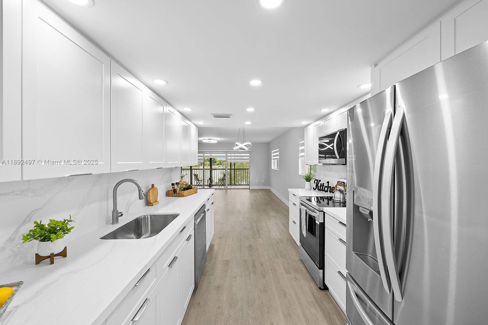 Experience the perfect blend of comfort and modern design in this beautifully updated 2BD 2BA corner unit with peaceful lake views.