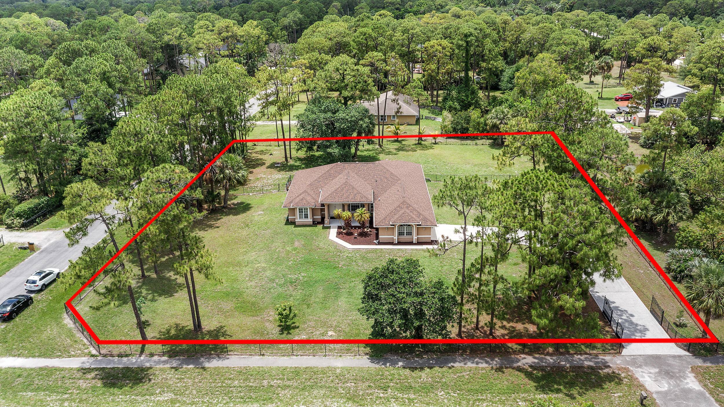Tucked away in the peaceful community of Loxahatchee, this stunning 4 bedroom, 3 bathroom home offers the ideal combination of modern amenities and tranquil rural living.