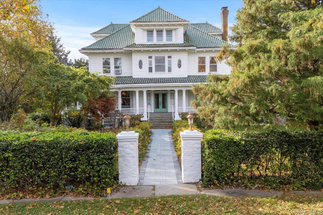 Step into the timeless grandeur of Wisteria Court, one of South Jamesport's most admired historic estates.