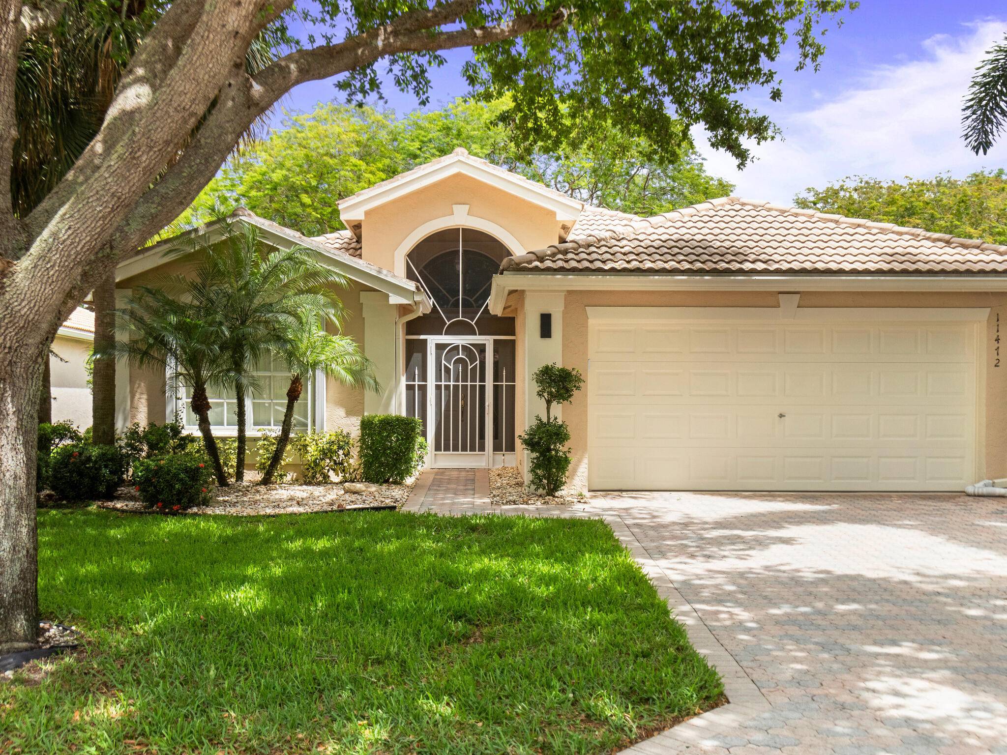 Light and bright MOVE IN READY South Pacific Model situated on an interior garden lot with a private backyard and plush landscaping !