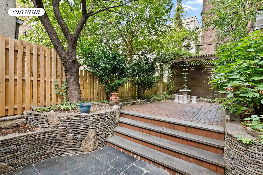 Welcome to 285 13th Street, a beautifully preserved four bedroom, three bath townhouse offering historic character, modern upgrades, and a lush private garden.