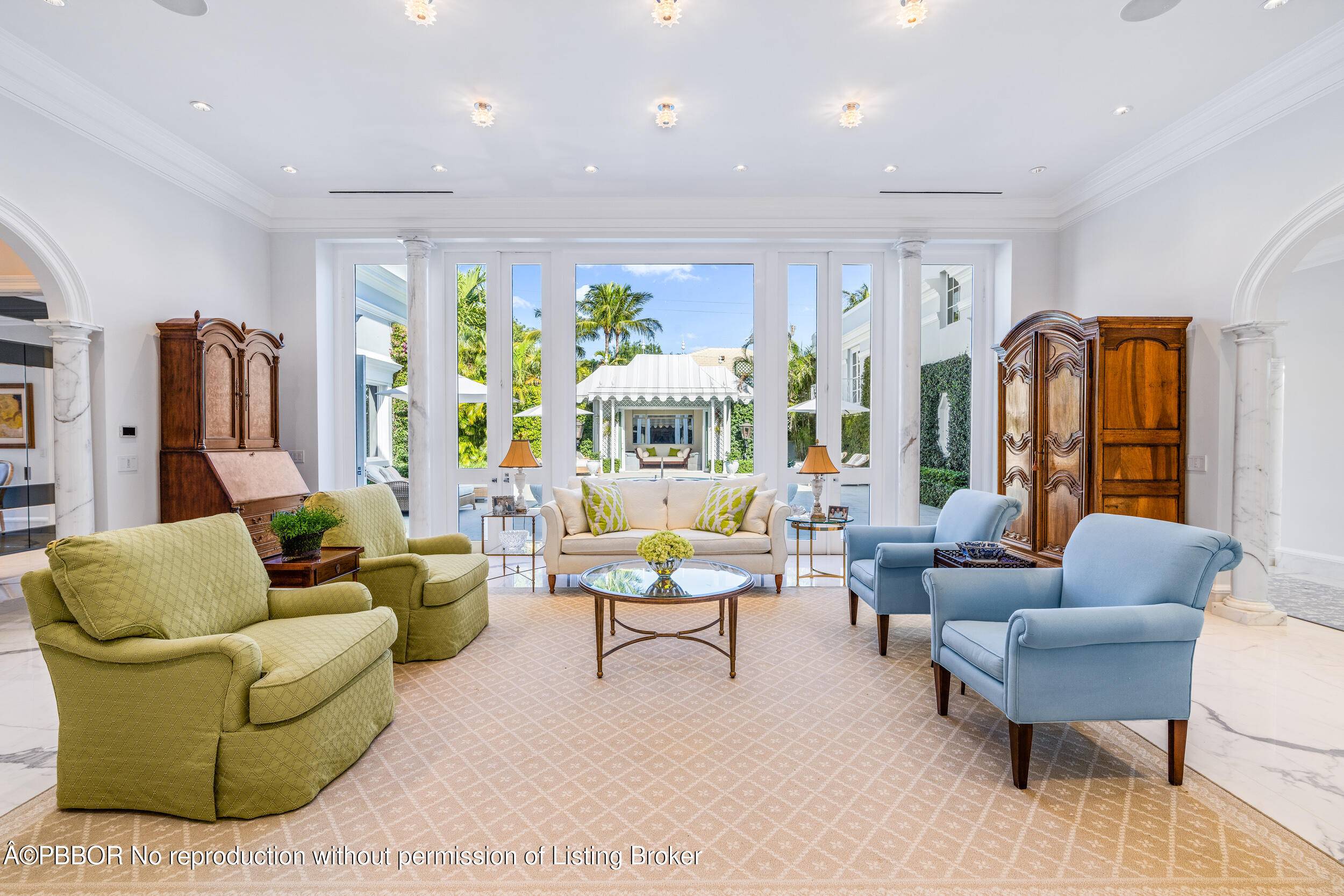 Regally elevated at 16' on over half acre this Palm Beach Palladian residence showcases quintessential architecture set within beautifully landscaped pool gardens.