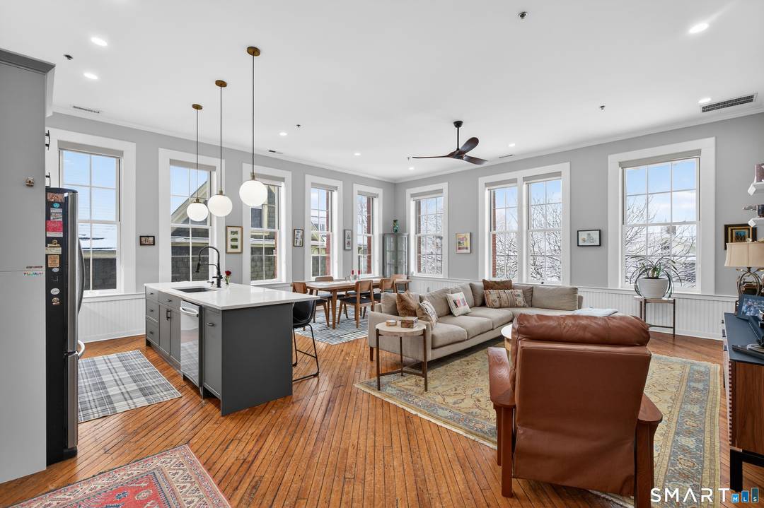 Sophisticated two bedroom, two bath corner unit condo located on the second and third floors of a converted schoolhouse building in the heart of East Rock.