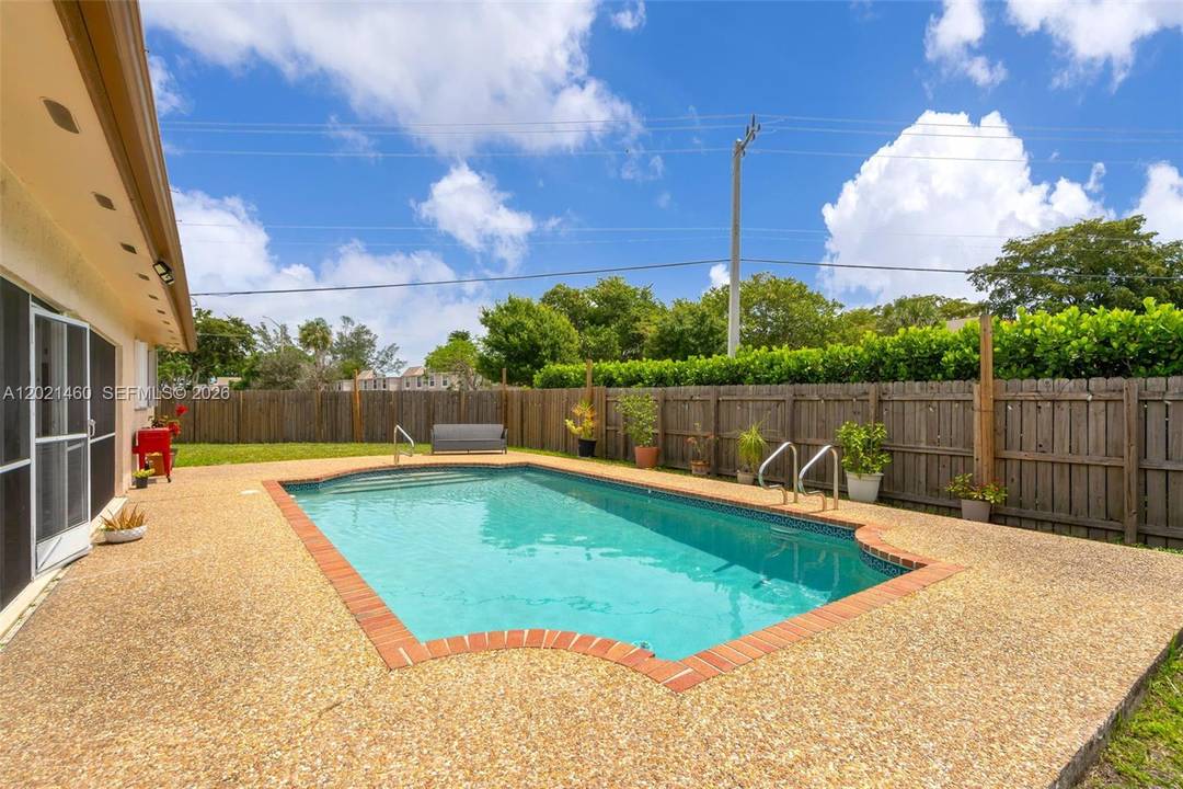 STUNNING CORNER LOT WITH A POOL !