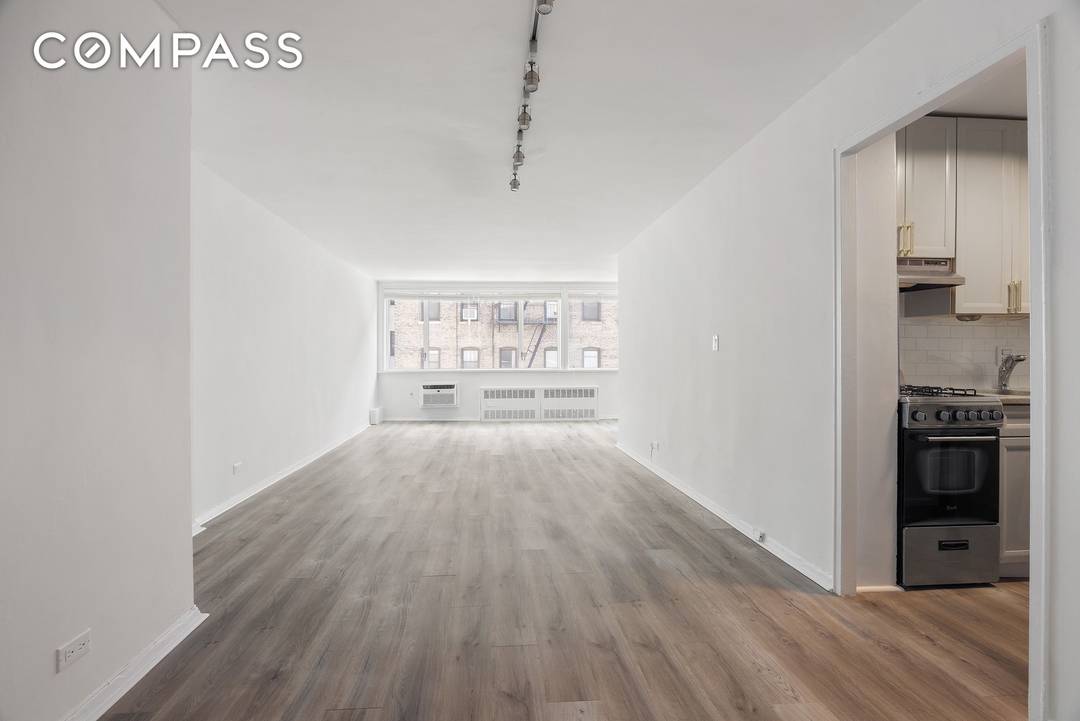 This thoughtfully designed alcove studio offers a highly functional layout, ideal for maximizing both style and space.