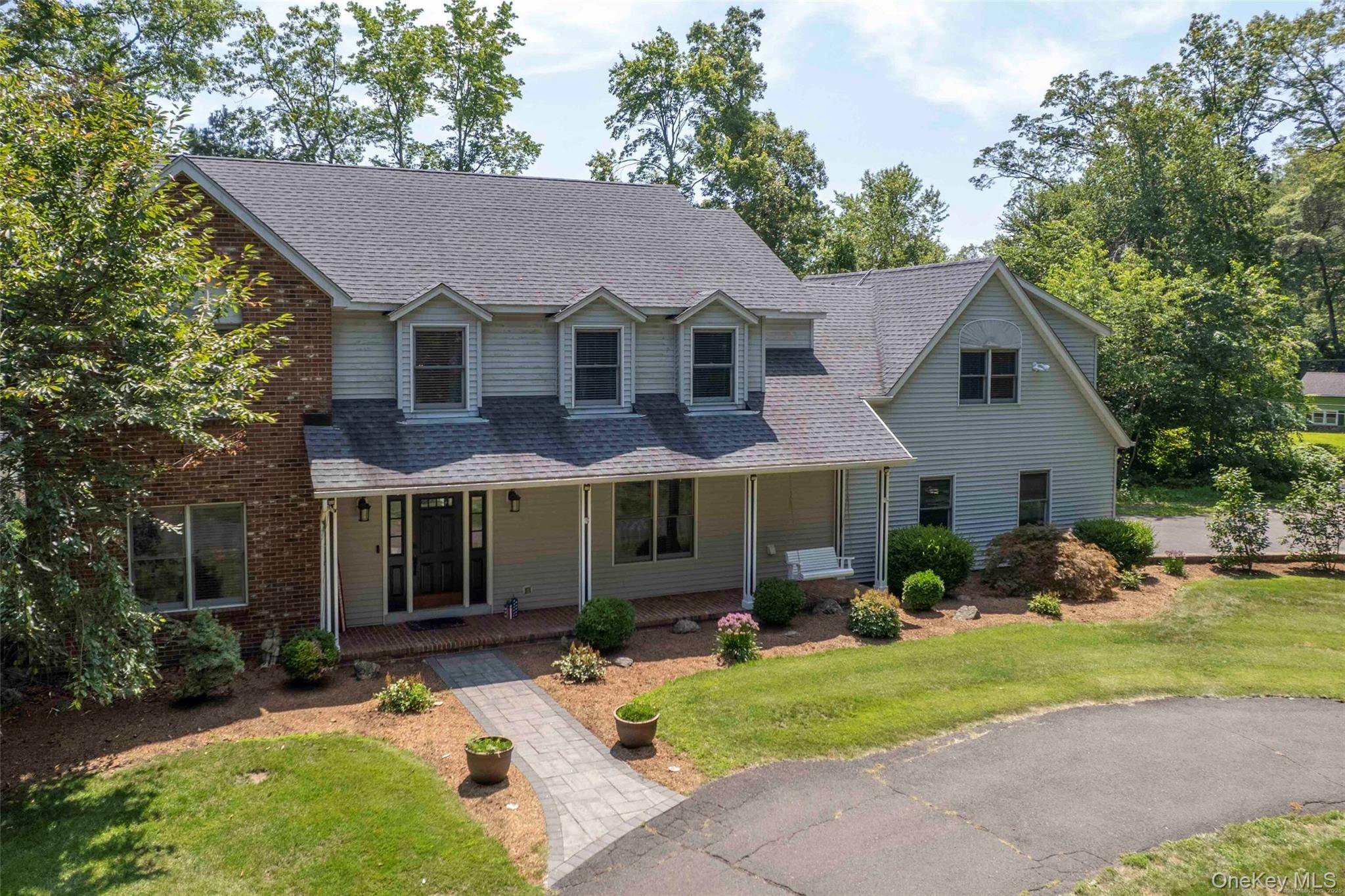 Welcome home ! This large colonial style home features 4 bedrooms, 2.