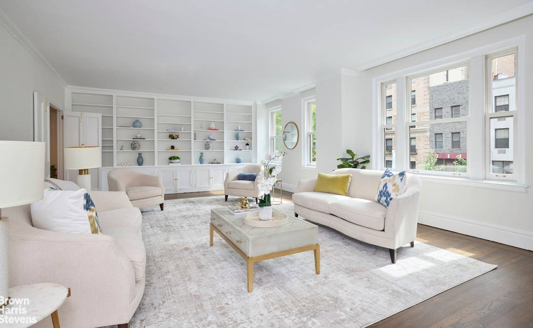 Flooded with natural light and tree top views, this lovely south facing duplex offers approximately 3, 200 sq ft of elegant living space in a beautifully maintained pre war building.