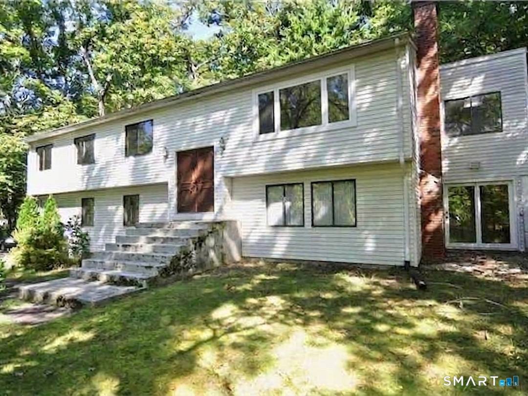 Spacious and versatile Raised Ranch offering 4 bedrooms and 3 full bathrooms on an almost one acre lot with plenty of outdoor enjoyment space.
