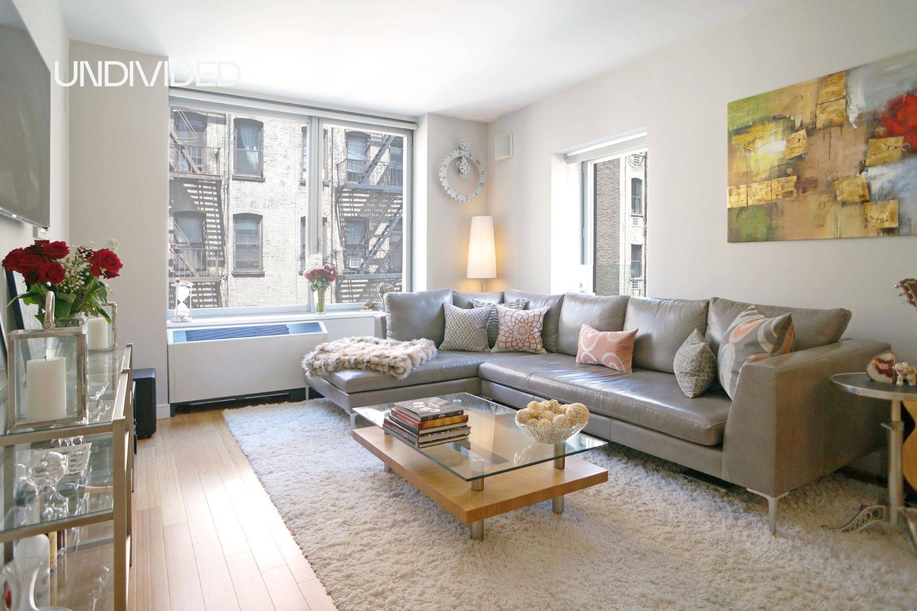 Residence 6F at 303 East 33rd Street offers approximately 874 square feet of modern, corner living with bright, north and east exposures.