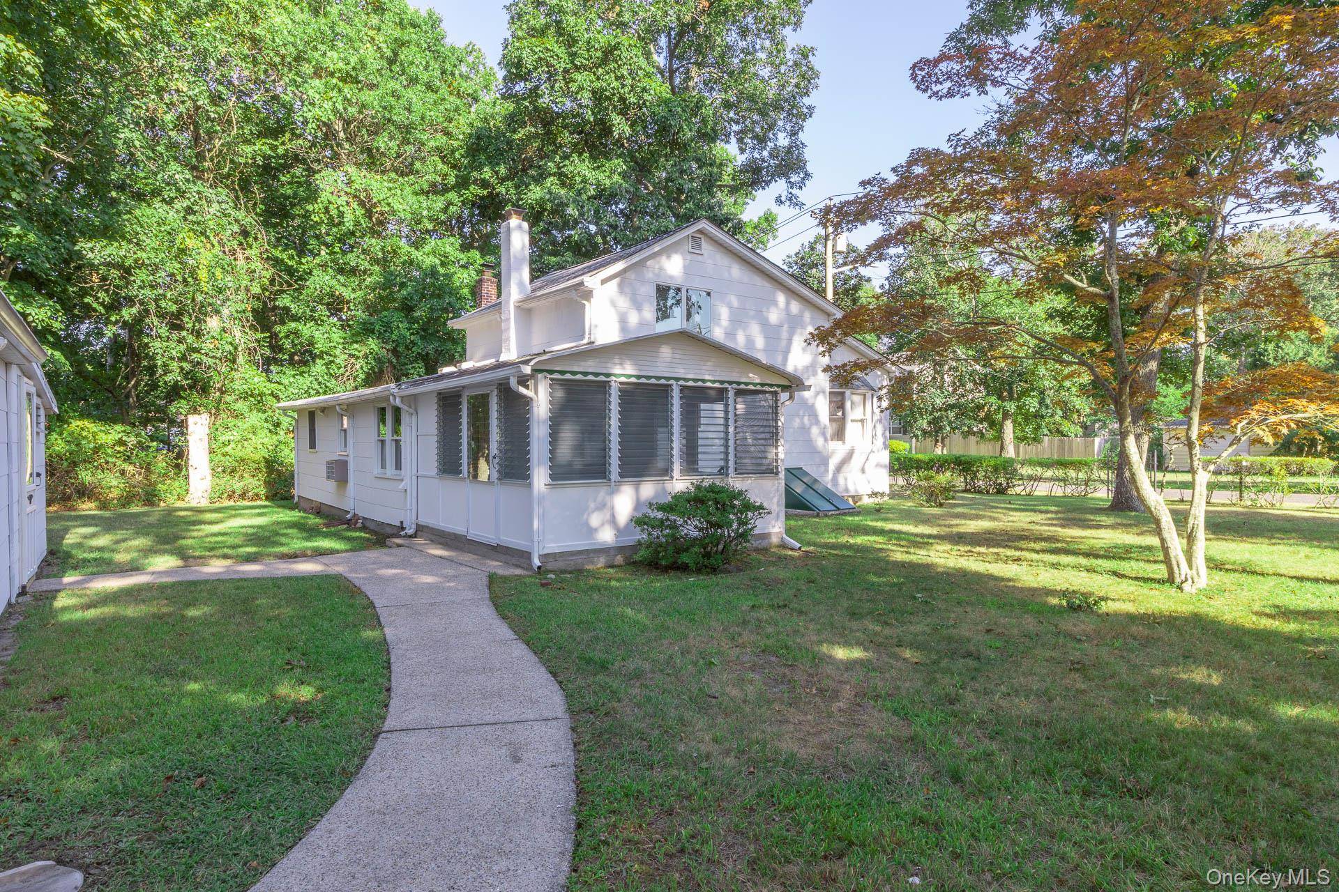 Step into classic 1930s character with this delightful 2 bedroom, 1 bath home nestled in the heart of Mastic Beach.