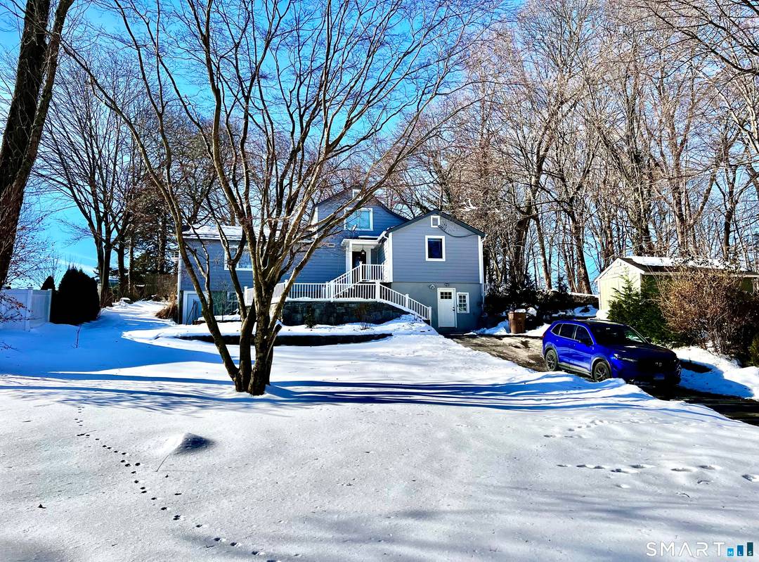 This Bright and Spacious Property is situated in a Prime Location and features numerous windows, sliding doors, and a kitchen skylight.