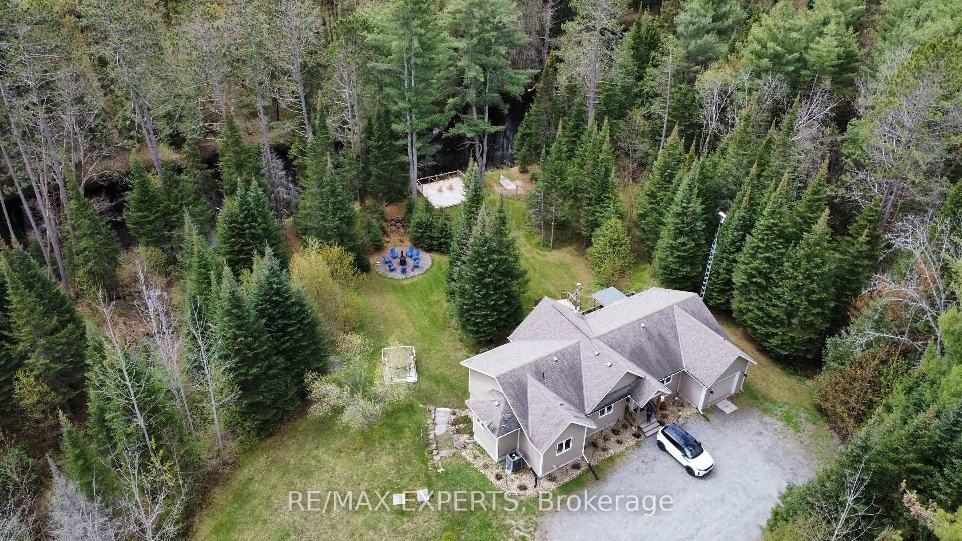 Welcome to This High Performing Short Term Rental A Private, Year Round Retreat on the Black River, Tucked away on 2 acres of beautifully treed land, this private amp ; ...