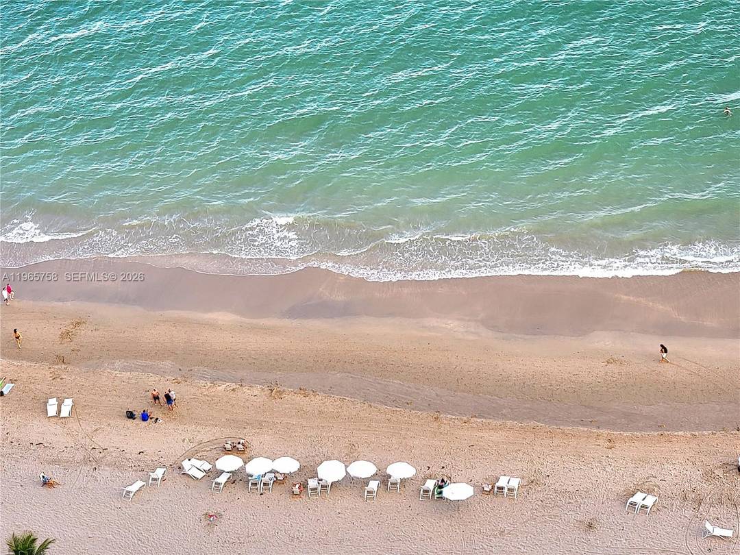 THIS BEACH CLUB OCEANFRONT RESIDENCE IS TRULY A HOME YOU CAN ENJOY !