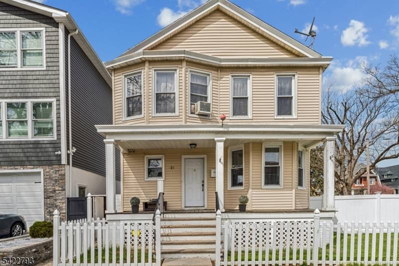 Welcome to 21 Ellington Street in East Orange, a charming colonial offering a comfortable layout, and an expanded outdoor setting.