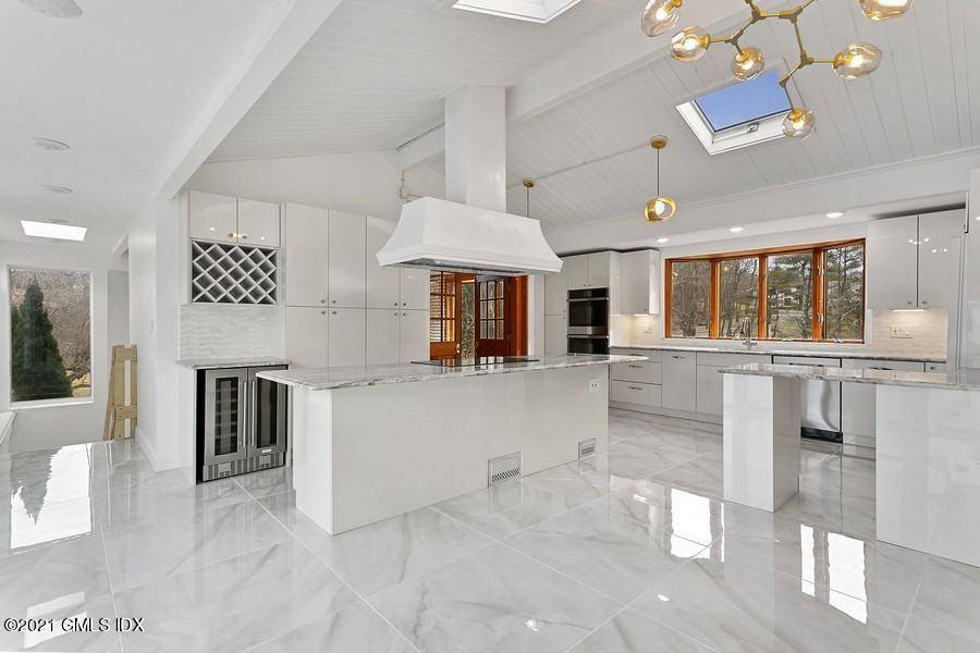 Modern light filled 7 Bedroom home w fantastic pool deck.